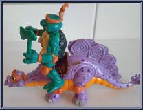 Cave Turtle Mike (with Silly Stegosaurus) from Teenage Mutant Ninja Turtles - Cave Turtles manufactured by Playmates [Loose]